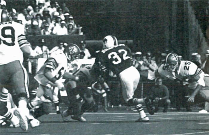 The New Orleans defense surrounds Buffalo RB O.J. Simpson (32) during a 1973 contest. Credit: nosaintshistory.com